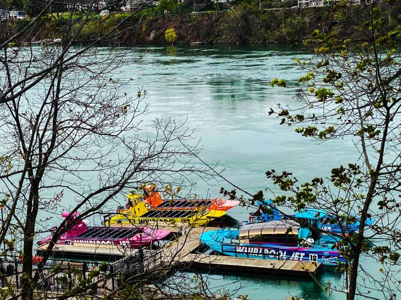 Brightly coloured members of the Whirlpool Jet Boats fleet sit at the Queenston dock on May 6, getting ready for a busy season . (Gail Kendall) 