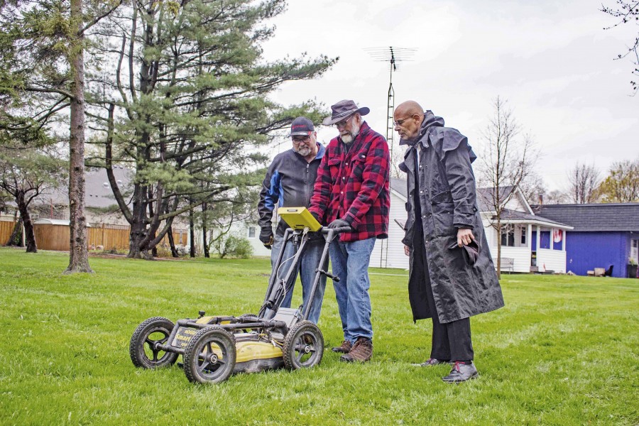Steve Watson and Don Johnston from Global GPR Services and Jim Russell puzzle over a soil anomaly found in the Negro Burial Ground on Mississauga Street. Russell hired the technicians to help locate the graves of some of the earliest Black residents of Niagara with ground penetrating radar. (Evan Saunders)