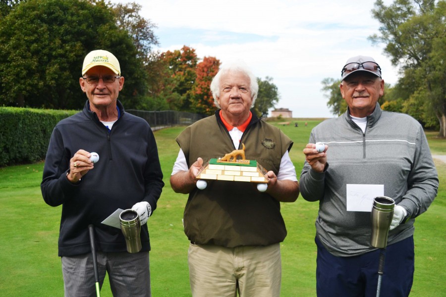 NOTL Golf Club Woofs league winners Ted Wiens, left, and Jim Meszaros, right, receive their prizes from league co-ordinator Bill Katrynuk. (Kevin MacLean photo) 