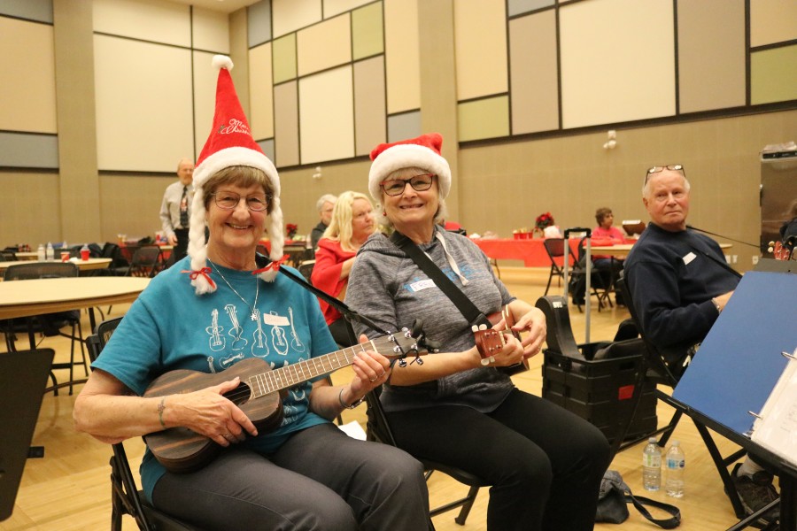 Carol Shore and Fran Burdett at the annual NOTL Ukesters Christmas party held at the NOTL Community Centre Sunday. (Dariya Baiguzhiyeva/Niagara Now)