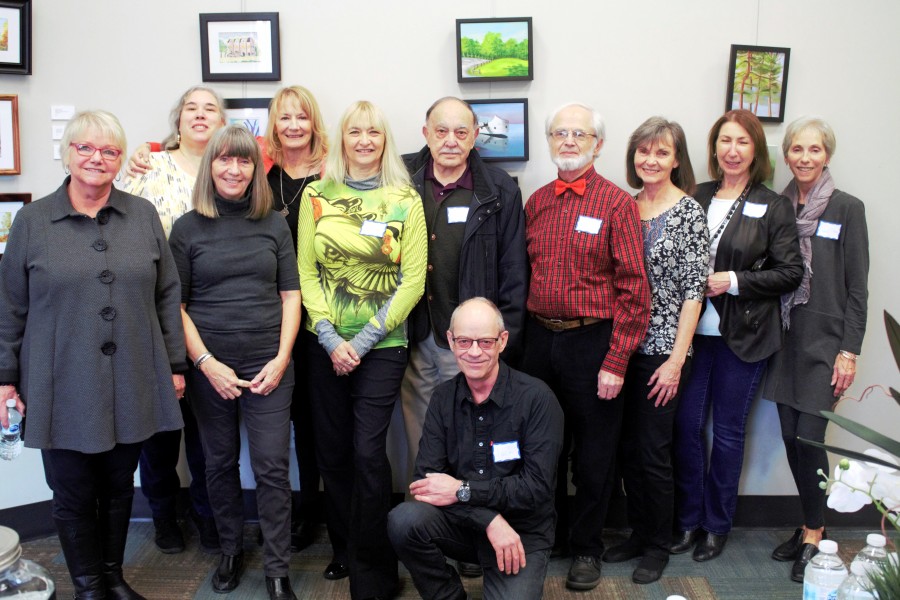 Eleven of the 13 Niagara Plein Air Artists who are showcasing their art all December at the library. (Brittany Carter/Niagara Now)