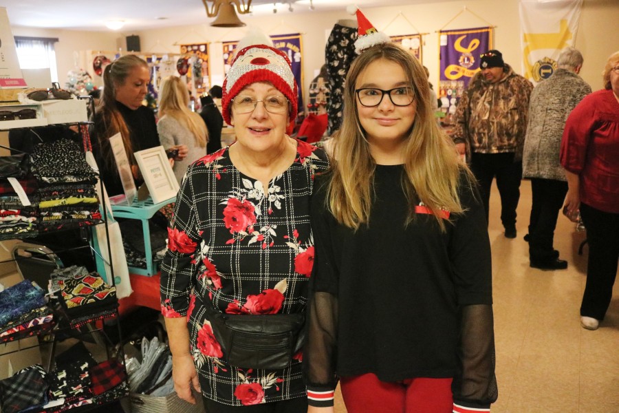 Event co-ordinator Diane Pewer with her granddaughter Alyssa Dauginas who helped to set up the event. (Dariya Baiguzhiyeva/Niagara Now)