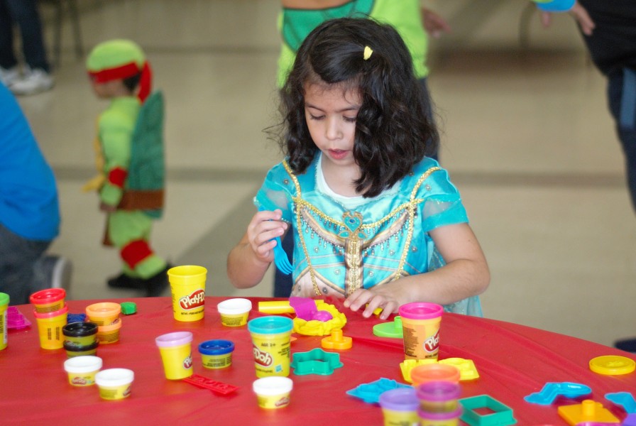 Hope Papadopoulos plays with Play-Doh during Saturday’s Harvest Party at the community centre. (Brittany Carter/Niagara Now)