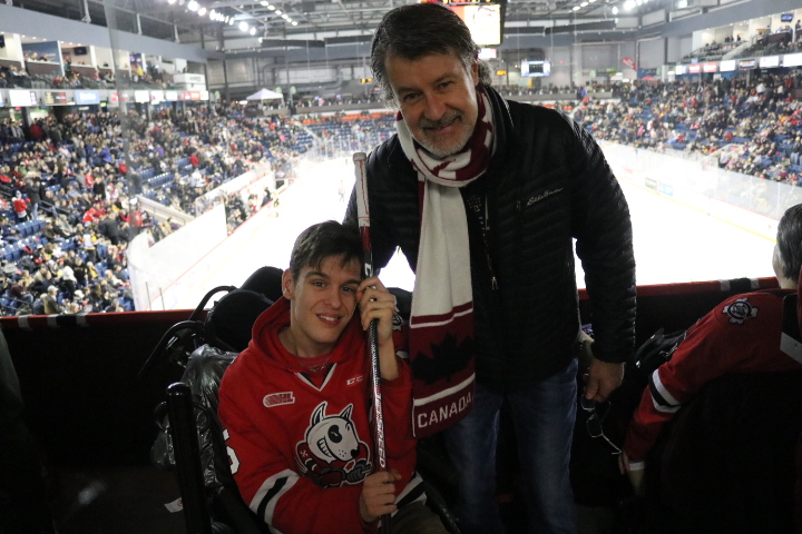 attended the Jan. 9 game at Meridian Centre in St. Catharines to ask Akil Thomas to sign a hockey stick. (Dariya Baiguzhiyeva/Niagara Now)
