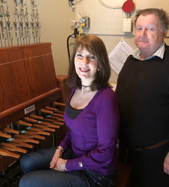The current chimers of St. Marks, Christine Bishop and Paul Wiebe, squeeze into the tiny keyboard room, two floors above ground and one floor below the belfry. (Tim Taylor/Niagara Now)