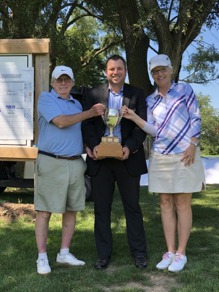 Paul and Ginny Green flank club pro Billy Simkin after winning the Matrionial tournament at NOTL Golf Club on Aug. 28. (Supplied)