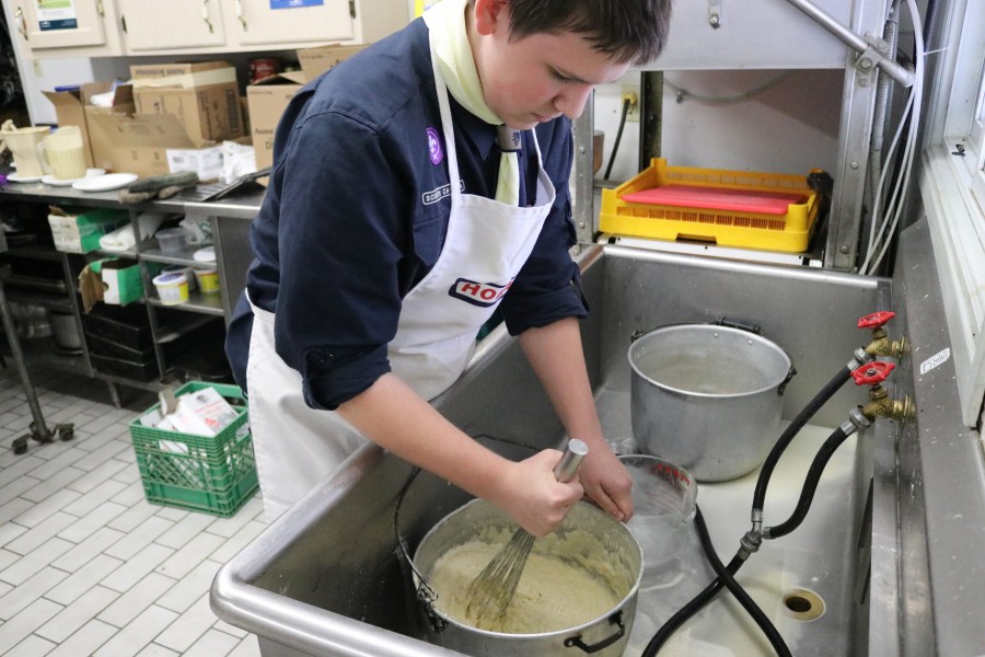 The club has 12 cubs, 8 beavers, 11 scouts and one venturer. Travis Pearsall, the only venturer scout, was helping at the kitchen making butter. Pearsall said he likes cooking. (Dariya Baiguzhiyeva/Niagara Now)