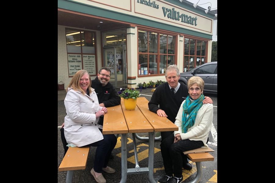 From left,Michele Hendriks, Tony Hendriks, Don Chambers and Ruth de Laat, in the picnic section of the Valu-mart lot  representing decades of old-town grocery retailing. (Tim Taylor/Niagara Now)