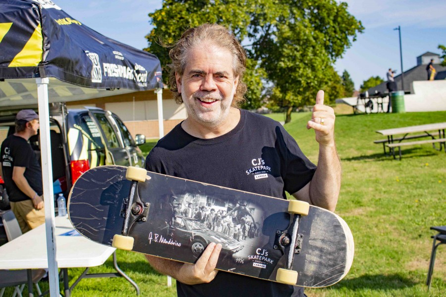 Jay Mandarino owns CJ's Skatepark in Mississauga and helped put on the skateboarding open house in NOTL. Here he is posing with his board adorned with a famous picture of him jumping a Ferrari in the 1970's. (Evan Saunders)