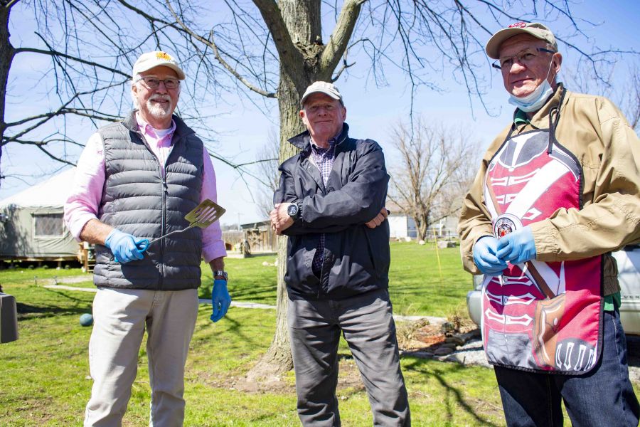 Rick Coyne, Tony Chisholm and Rick Meloen were slinging hotdogs and knowledge at a fundraising barbecue for the Heritage Trail on April 22. (Evan Saunders)