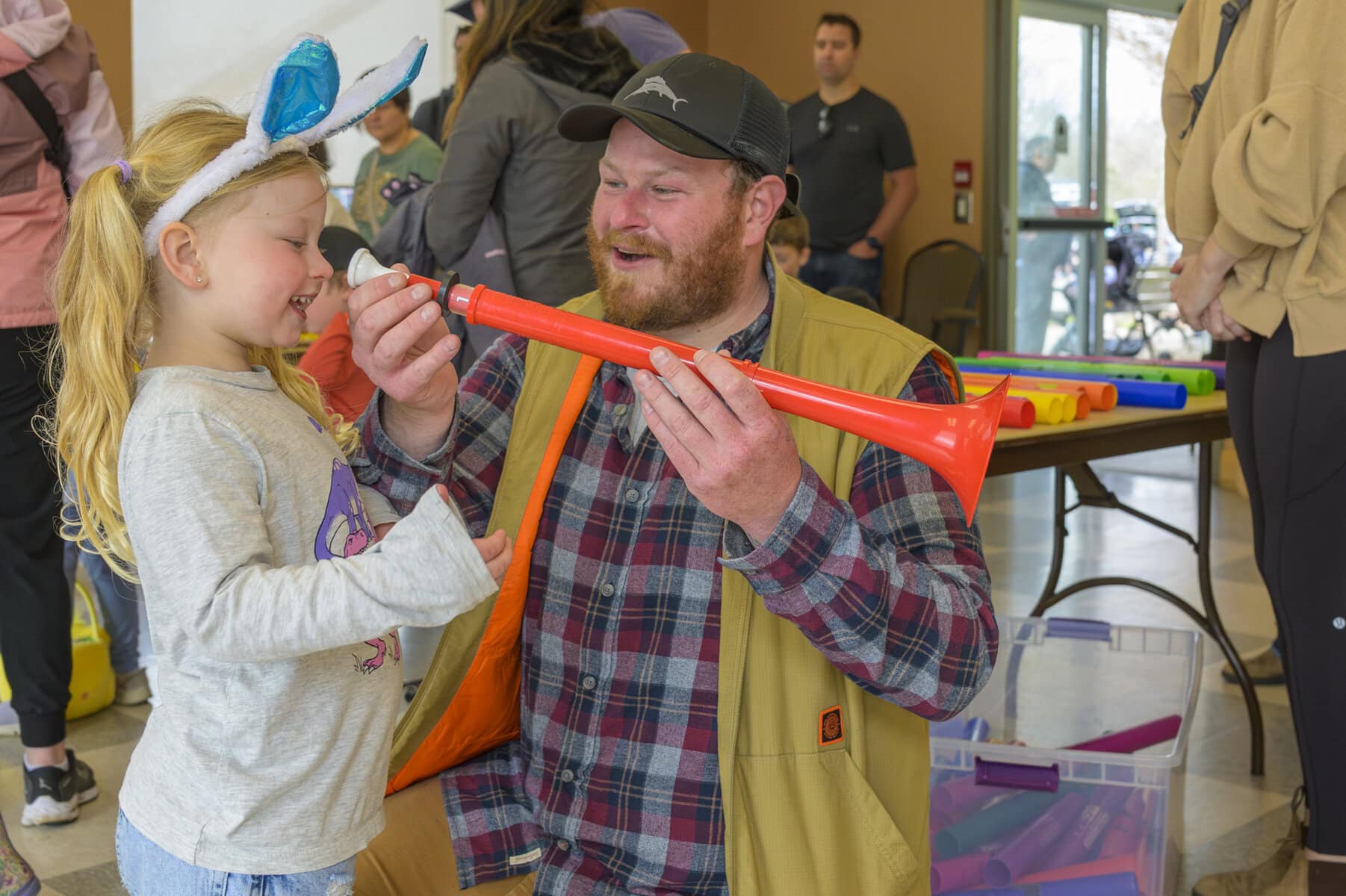 Lake Van de Laar, 4, and father Tanner Van de Laar learn to play the horn. 