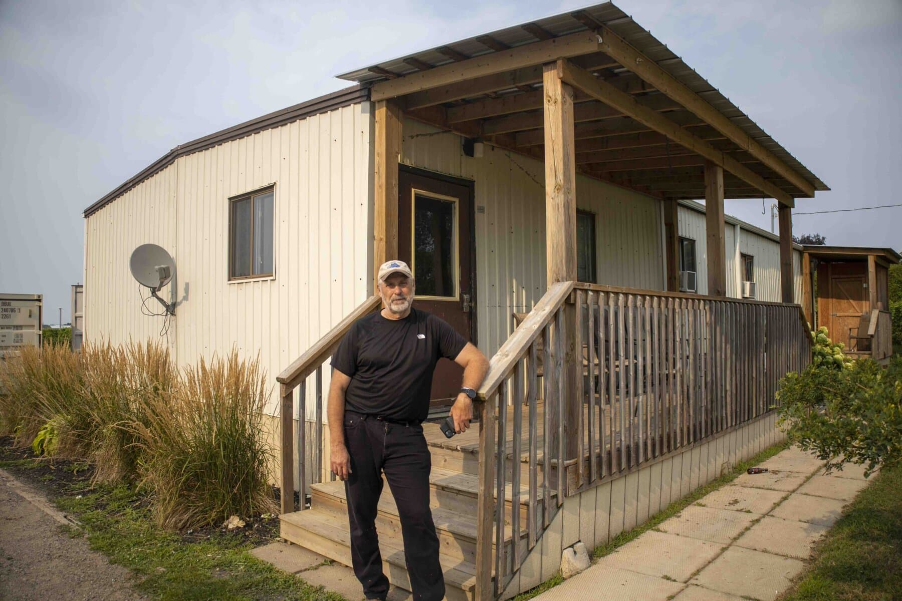 Farmer and Niagara-on-the-Lake councillor Erwin Wiens stands outside the farm’s worker housing. While the workers were away and not photographed, he allowed The Lake Report to tour the interior, pending the workers' permission to take photos.