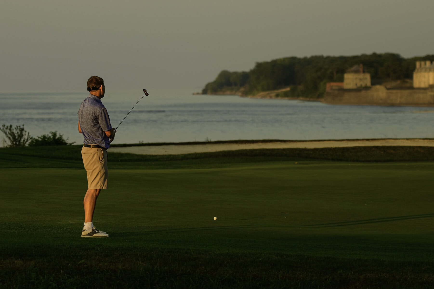 Eventual men's champion James Grigjanis-Meusel eyes his putt on the first playoff hole.