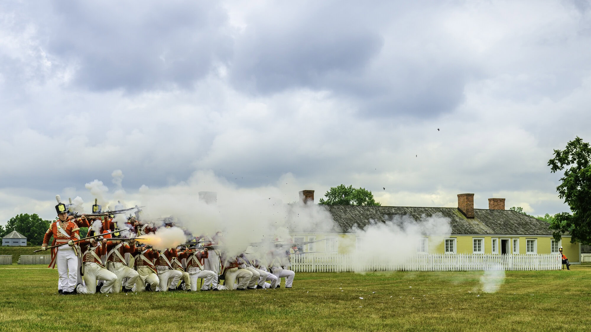 Ready, aim, fire: Re-enactors fire off a perfect volley in a firepower demonstration at the Fort George's Soldiers Field Day this past weekend.