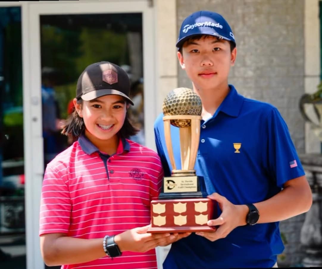 Golfers Eli Perng, left, and Kaige Zhu hold the trophy their school team won in the DSBN St. Davids Invitational in June. This week the pair competed in the Canadian under-15 championships in B.C.