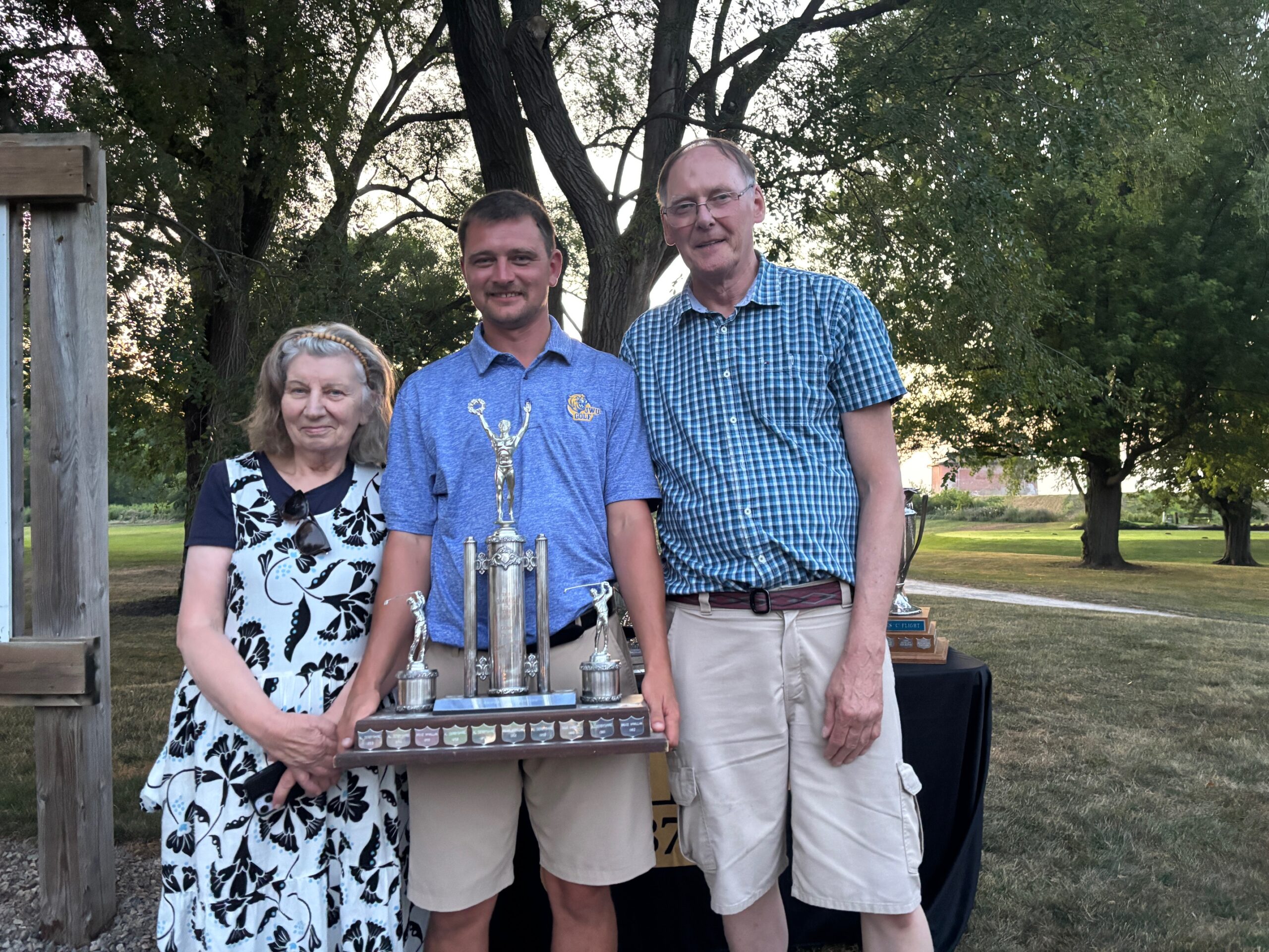 James Grigjanis-Meusel is congratulated by his proud parents Daina and Heinz after winning the men's championship. 