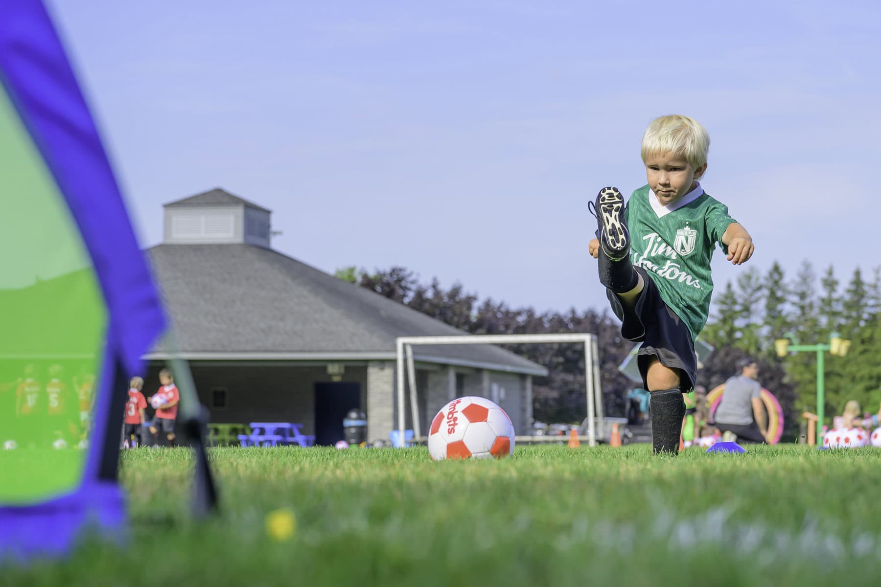 Another Cristiano Ronaldo in the making. Four-year-old Gideon Korevaar gives it his all on the soccer field, playing for the green Timbits team.