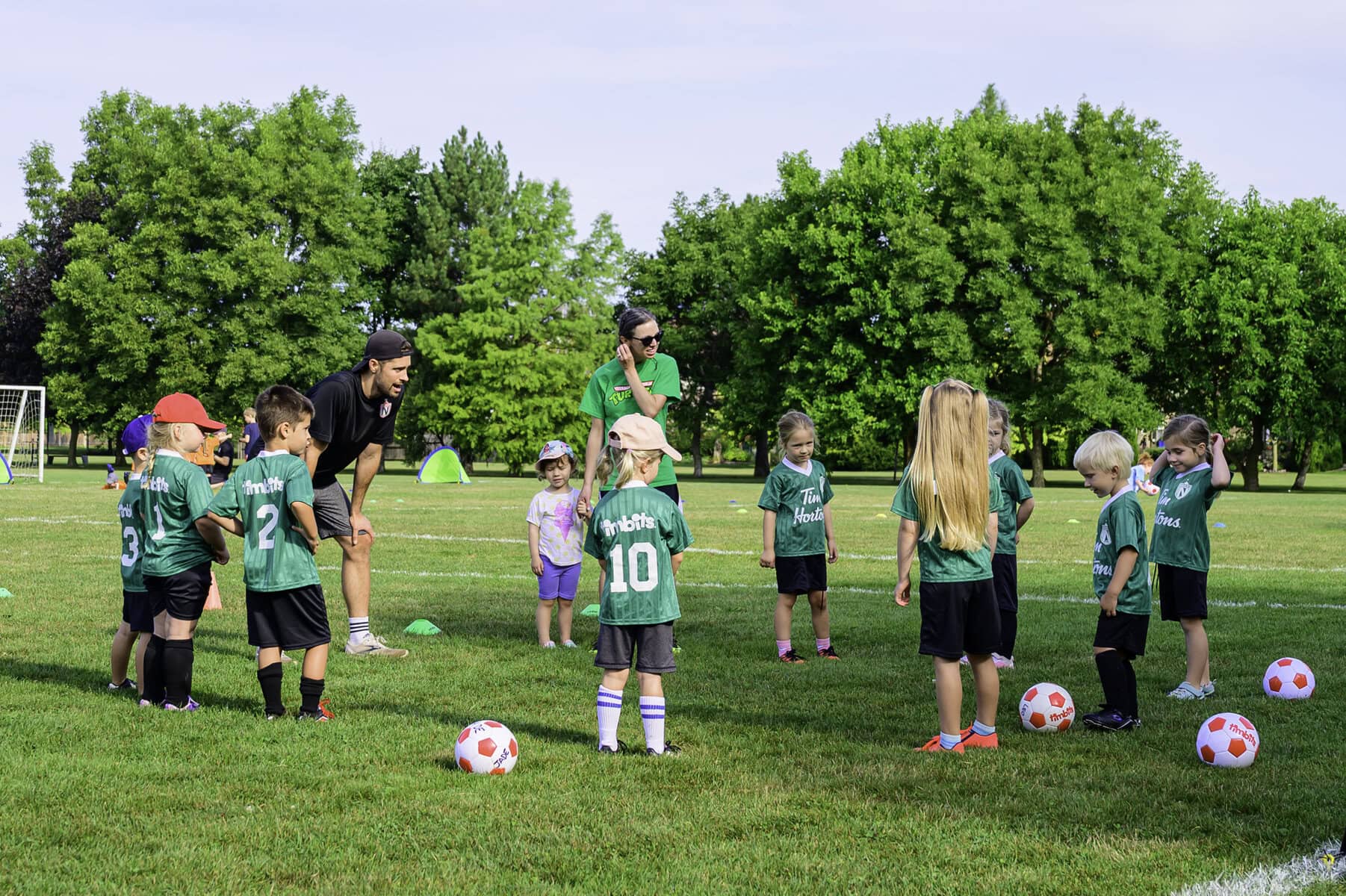 Coaches Corey Fowler and Rachel Georz set their team up for success with a few instructions before game time.