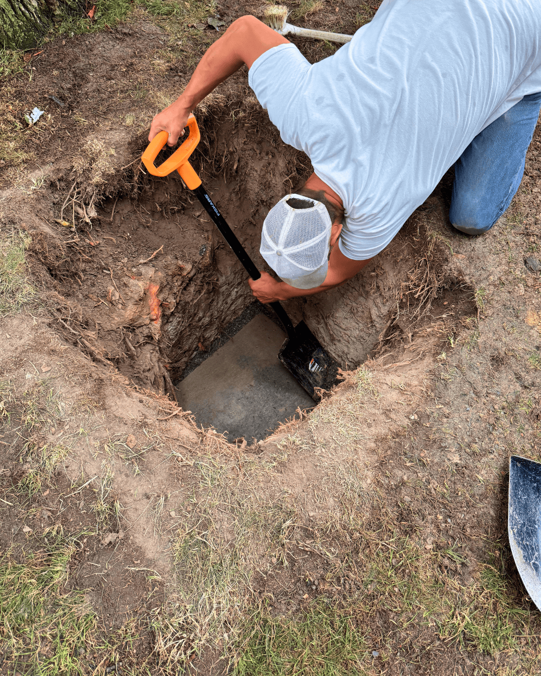 Worker digs as part of the restoration project.