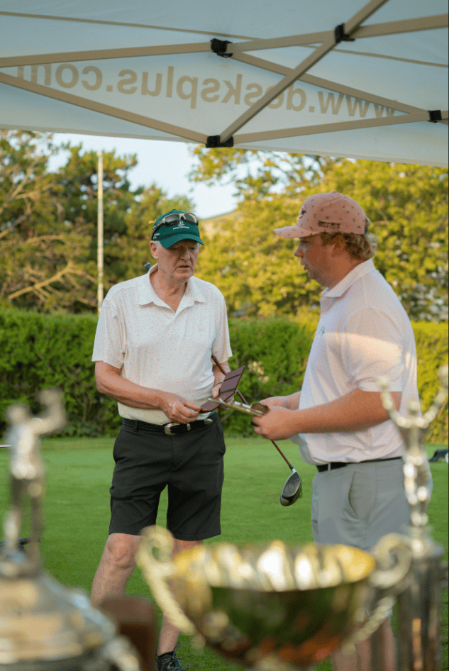Paul Dickson chats with club pro Owen Howells prior to Saturday's first round. Dickson ended up disqualifying himself after he took in an incorrect drop on one hole.