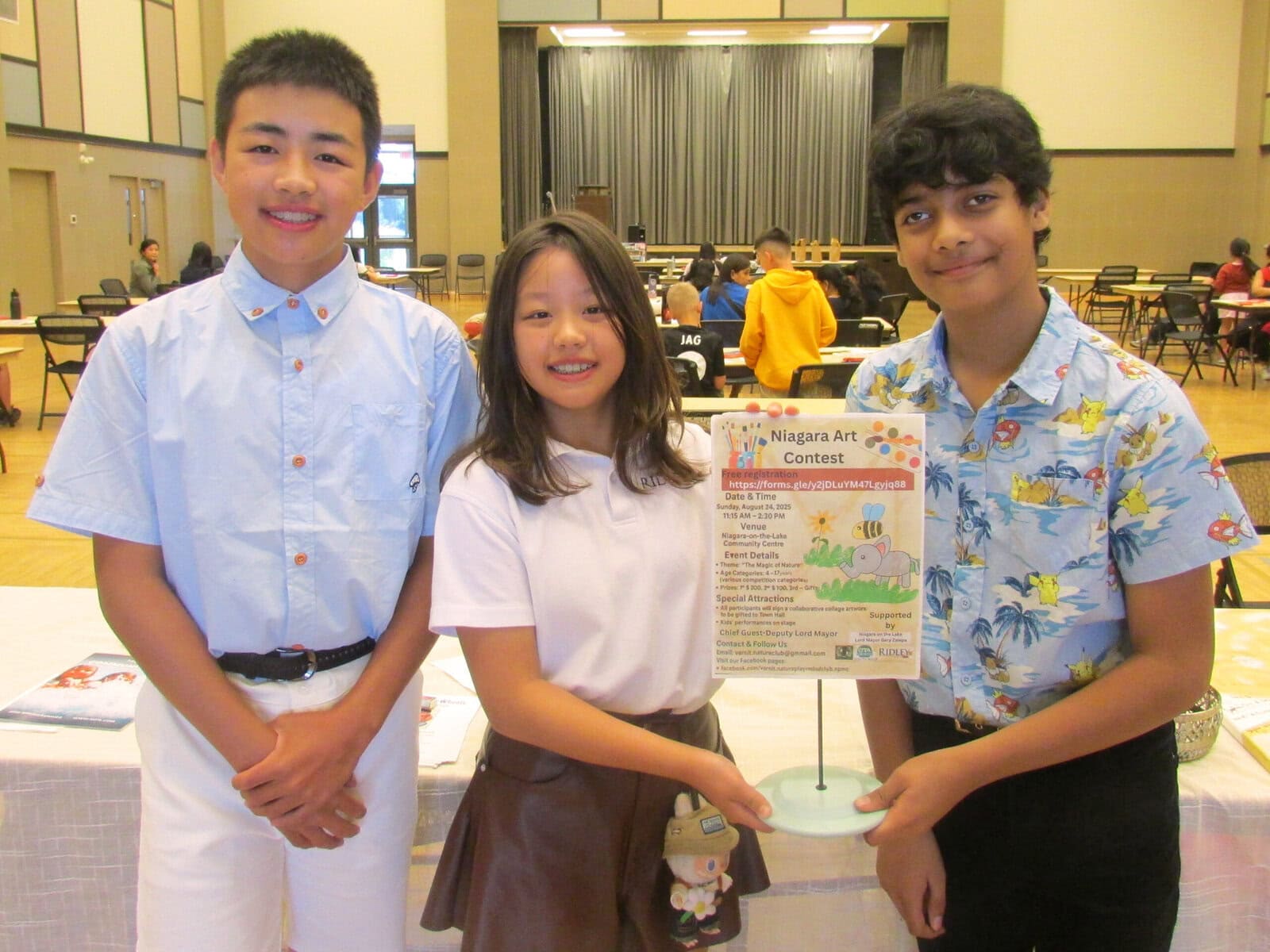 Skyler Gao, Sophia Gao and Varnit Rore, the organizers of a kids' art contest at the NOTL Community Centre. The contest's theme was "The Magic of Nature."