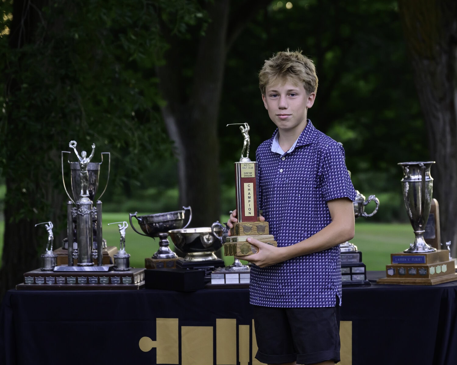 Steven Pillitteri-Smith holds his trophy for winning the bantam boys championship.
