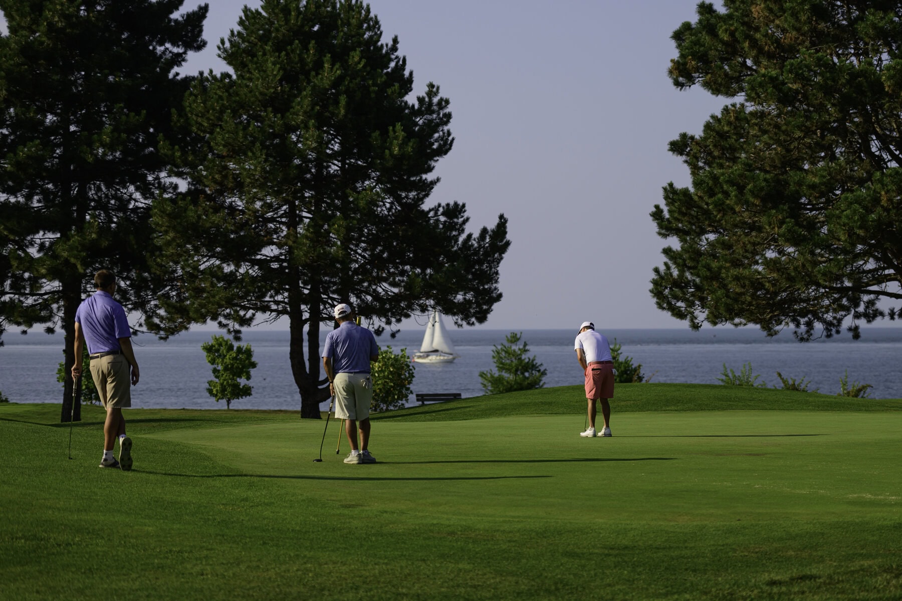 The lake views along the NOTL Golf Course can be spectacular. Here, Ricky Watson putts on the third green. 