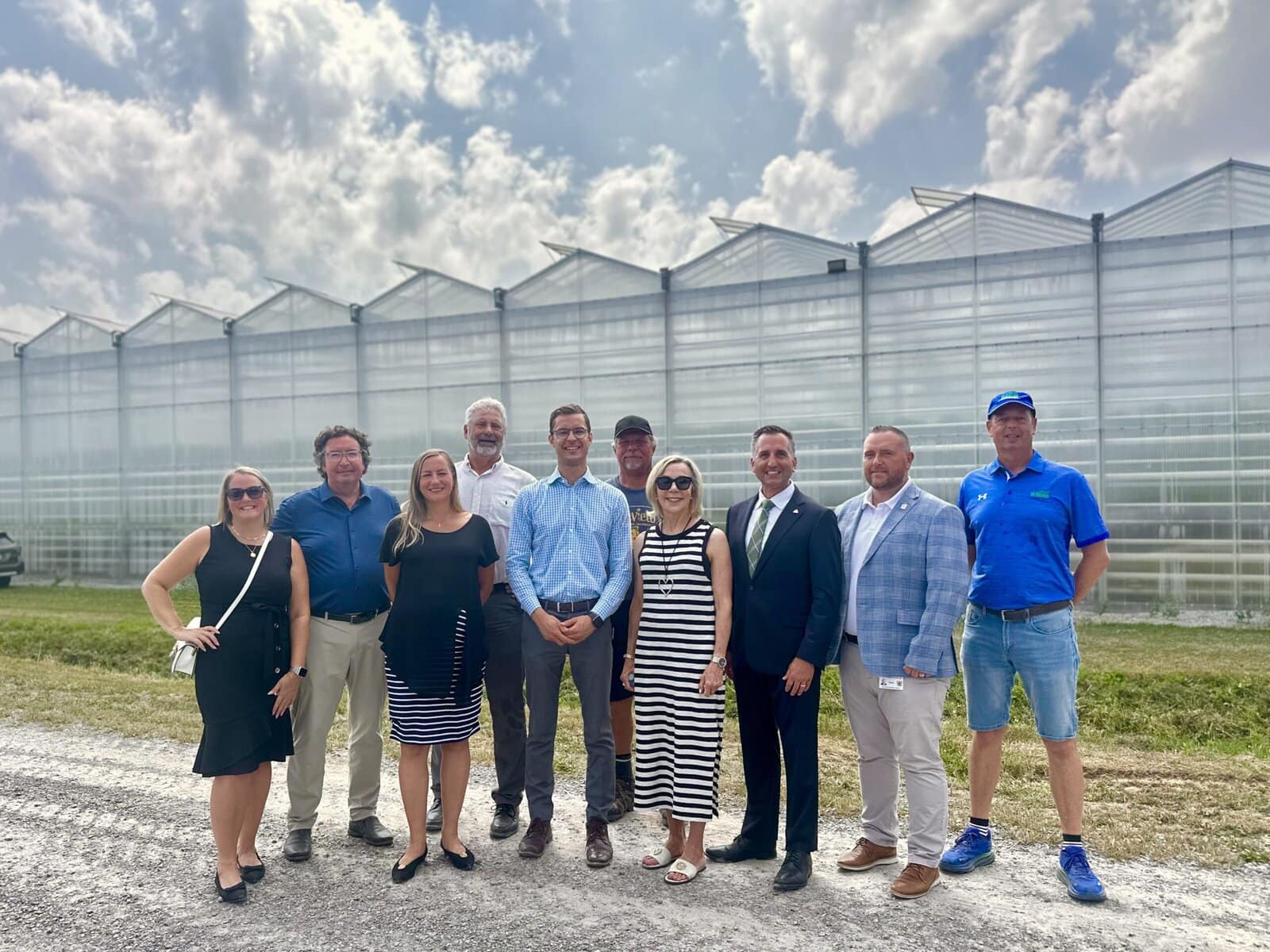 From left, Town of NOTL economic development officer Ashleigh Myers, NOTL Lord Mayor Gary Zalepa, minister of infrastructure Kinga Surma, NOTL Deputy Lord Mayor Erwin Wiens, Conservative MPP Sam Oosterhoff, farmer and irrigation committee member Kevin Buis, NOTL Coun. Wendy Cheropita, minister of agriculture Trevor Jones, NOTL chief administrative officer Nick Ruller and St. David’s Hydroponics vice-president Toine van der Knaap gather outside the greenhouse during Monday’s provincial irrigation funding announcement.