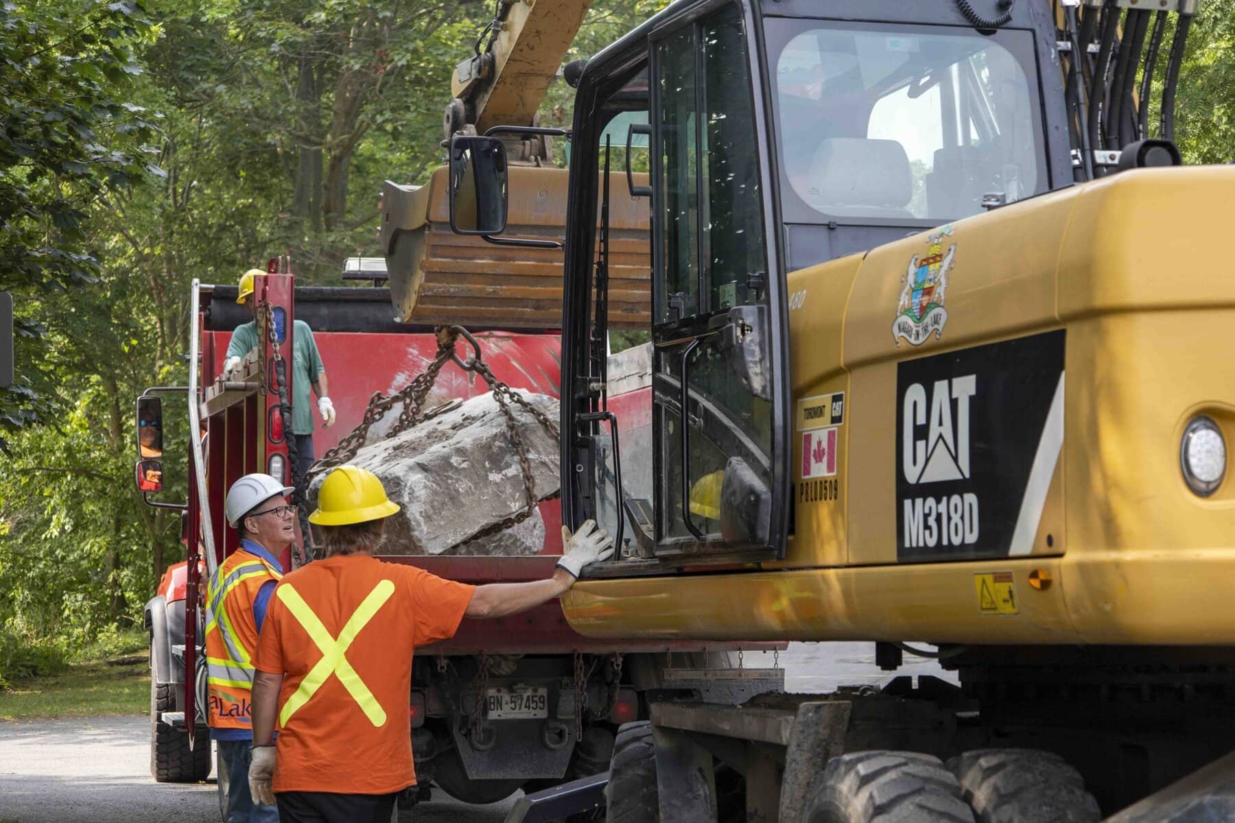 Niagara-on-the-Lake roads crew unloads one of the limestone blocks donated by Queenston Quarry, which will be split and shaped to help restore the turntable’s missing segments.