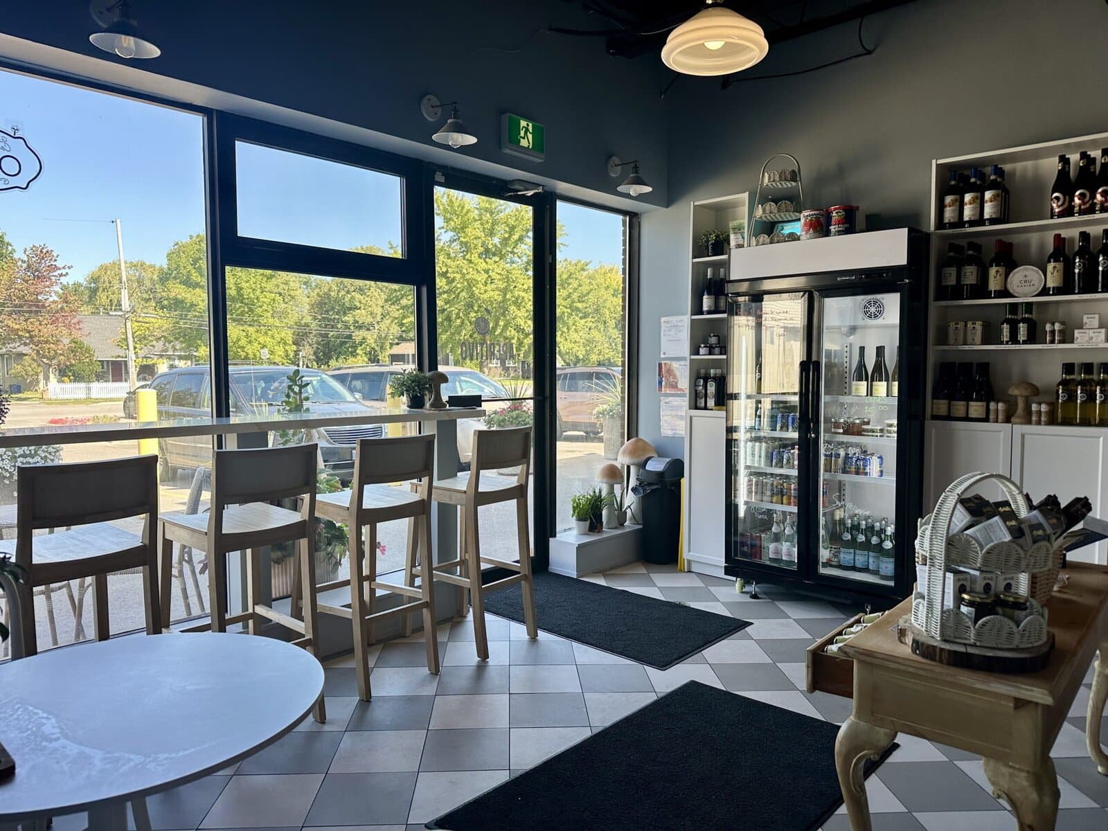 The front seating area and market shelves at Aperitivo by Revé, which features Sicilian olive oils, wines and other imported products.