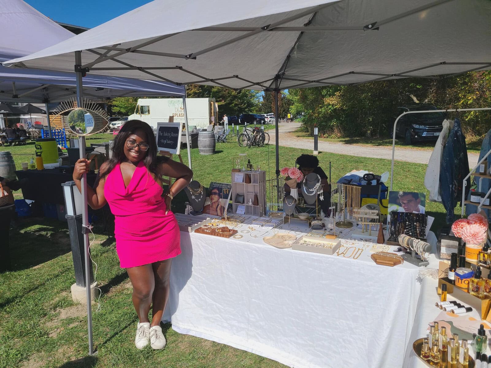 Keanne Antwi of Armure & Co. Jewelry & Lifestyle greets visitors at her stand, featuring handcrafted jewelry and natural skincare products. 