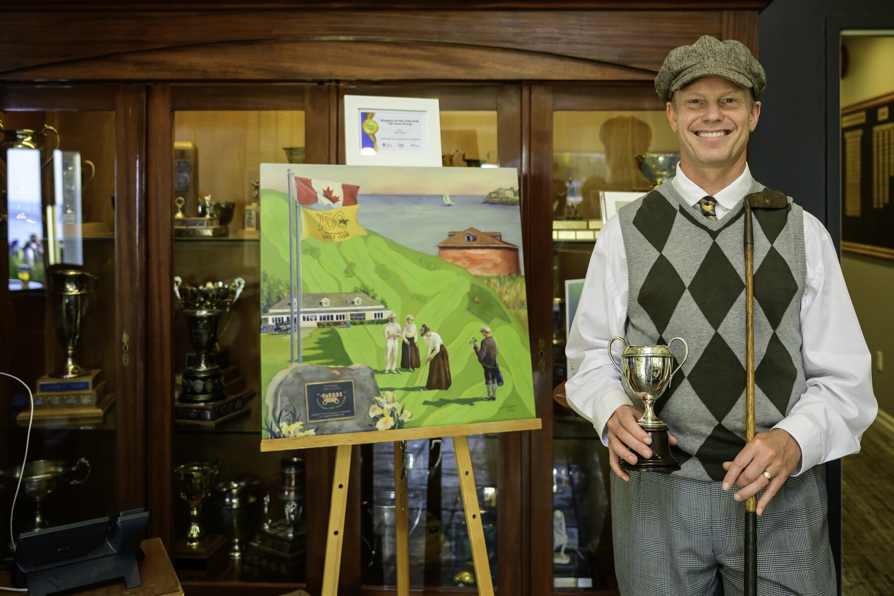 The NOTL Museum's David Servos was on hand to talk about the history of the town and the club. He's shown with Gail Kerr's award-winning painting commemorating the 150th. Prints of the work are available for purchase.