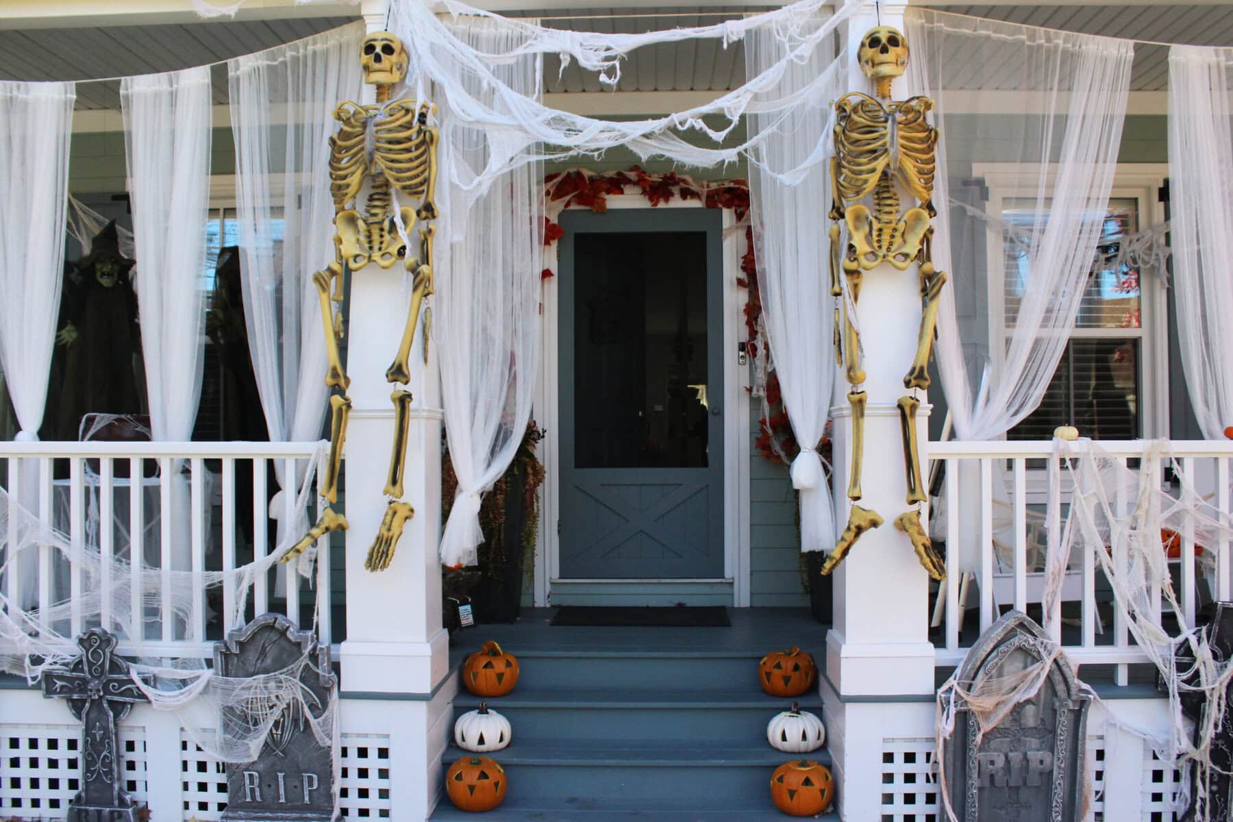 Gordon Stratford and his wife, Lyn, populate their front porch with an array of Halloween staples, light and dark.