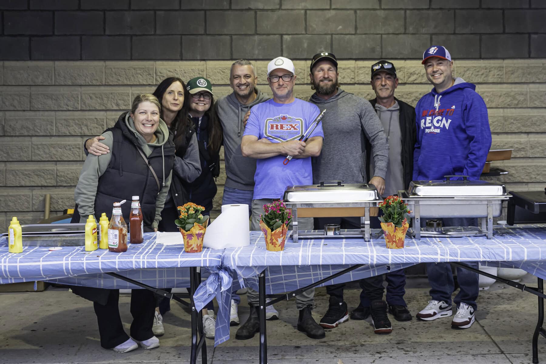 It takes a small army of dedicated volunteers to make the province-wide Harvest Classic Rep Tournament happen every year in Niagara-on-the-Lake. These are some of its volunteers. From left: Elana Wilkinson, Meredith Raso, Marie Good, Eric Ferreira, Dan Plomish, Eric Wilkinson,  Phil Raso and Dan Good.