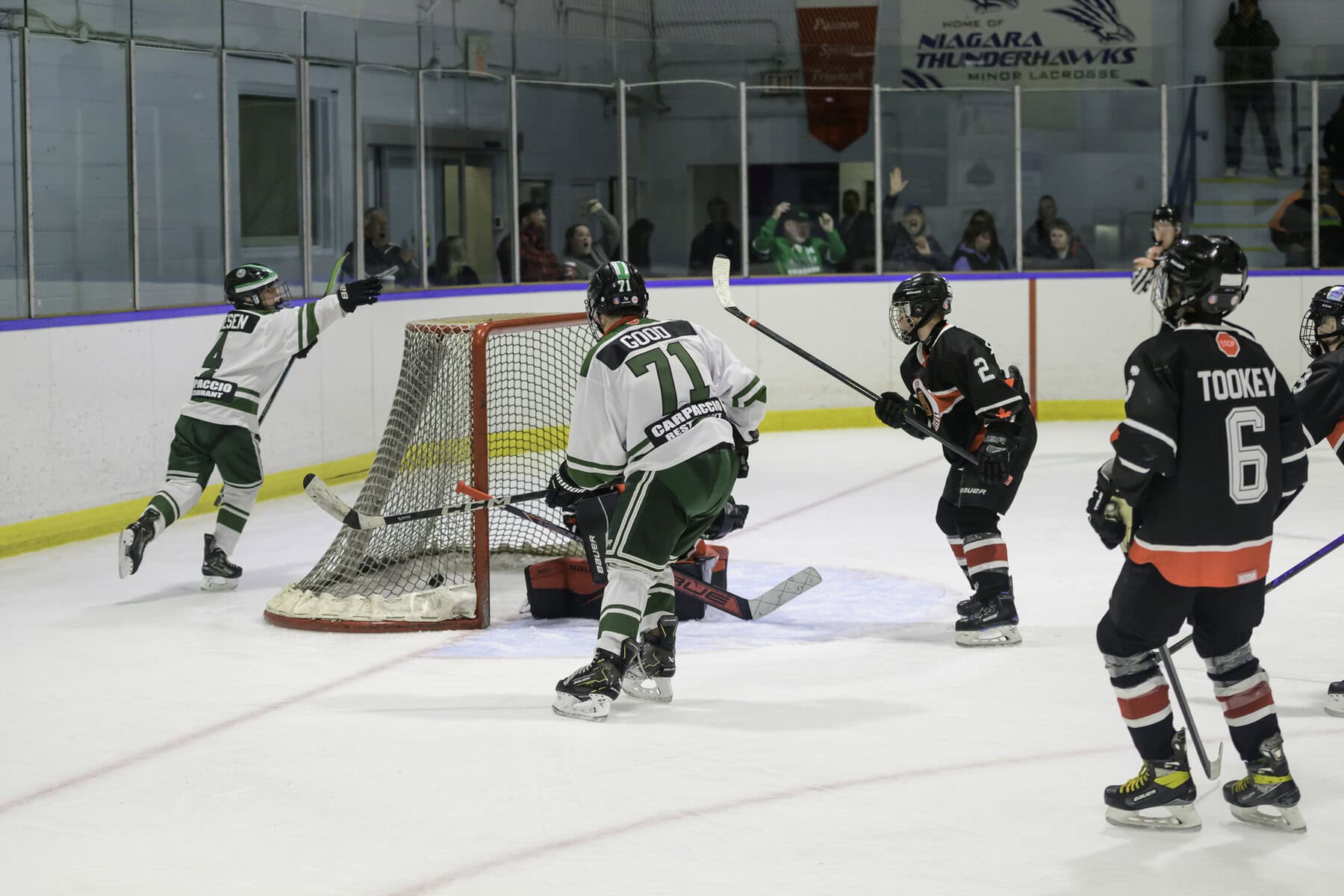 Jack Friesen, #4, throws his arms in celebration after teammate Ike Good, #71, scores the go-ahead goal, lifting the U13 NOTL Wolves to a 2-1 victory over Ayr.