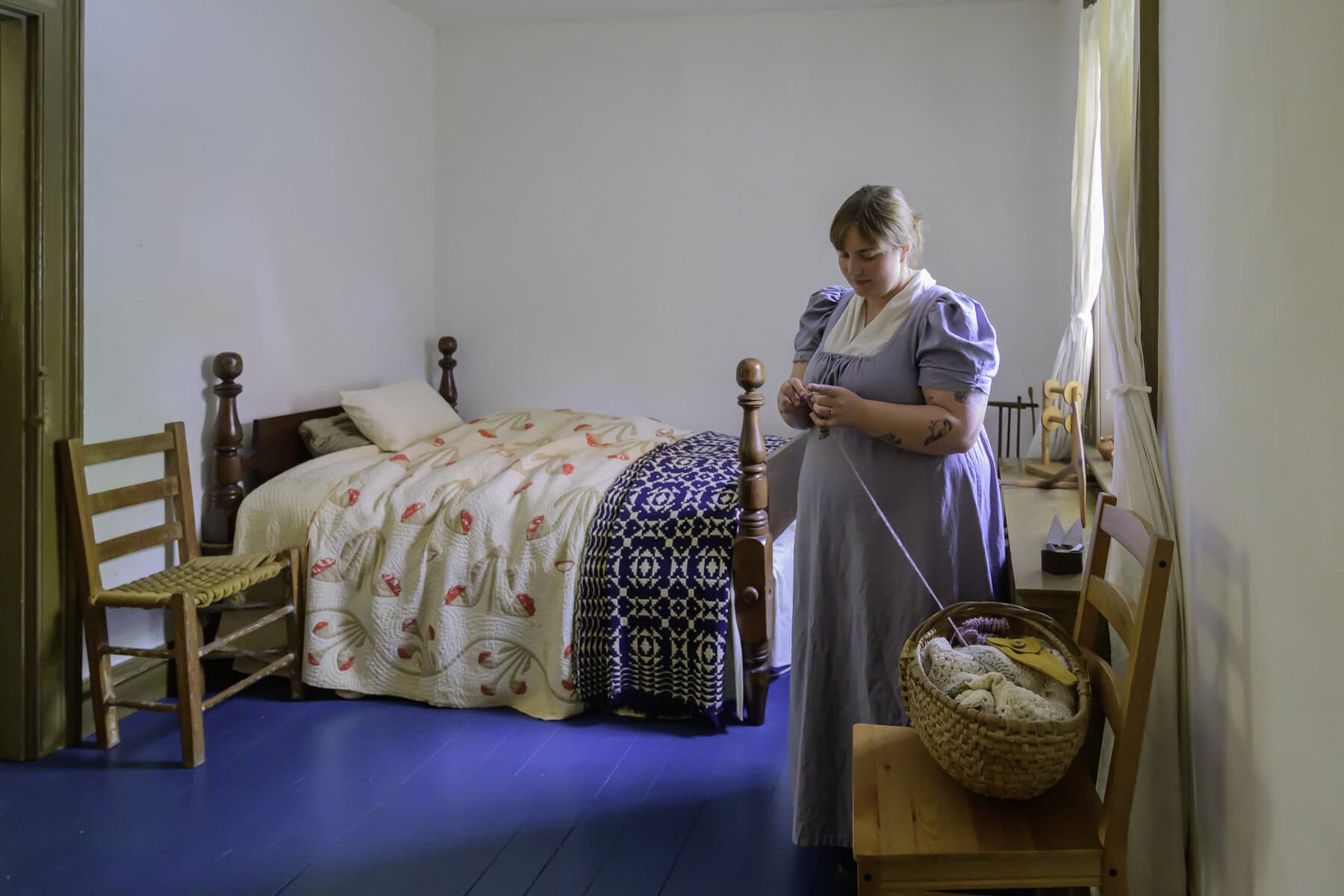 Julianna Farna crochets in the Governess Room of McFarland House. 