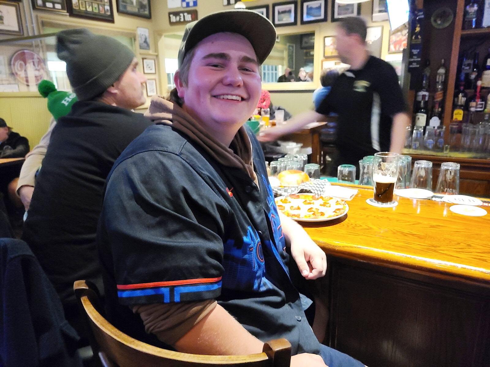 Luke Skubel, a Jays fan from Virgil in his jersey, watches Game 1 at the Sandtrap Pub & Grill.