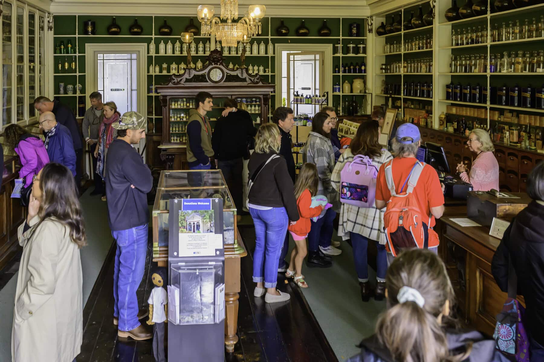 Visitors peruse various historic items at the Niagara Apothecary.
