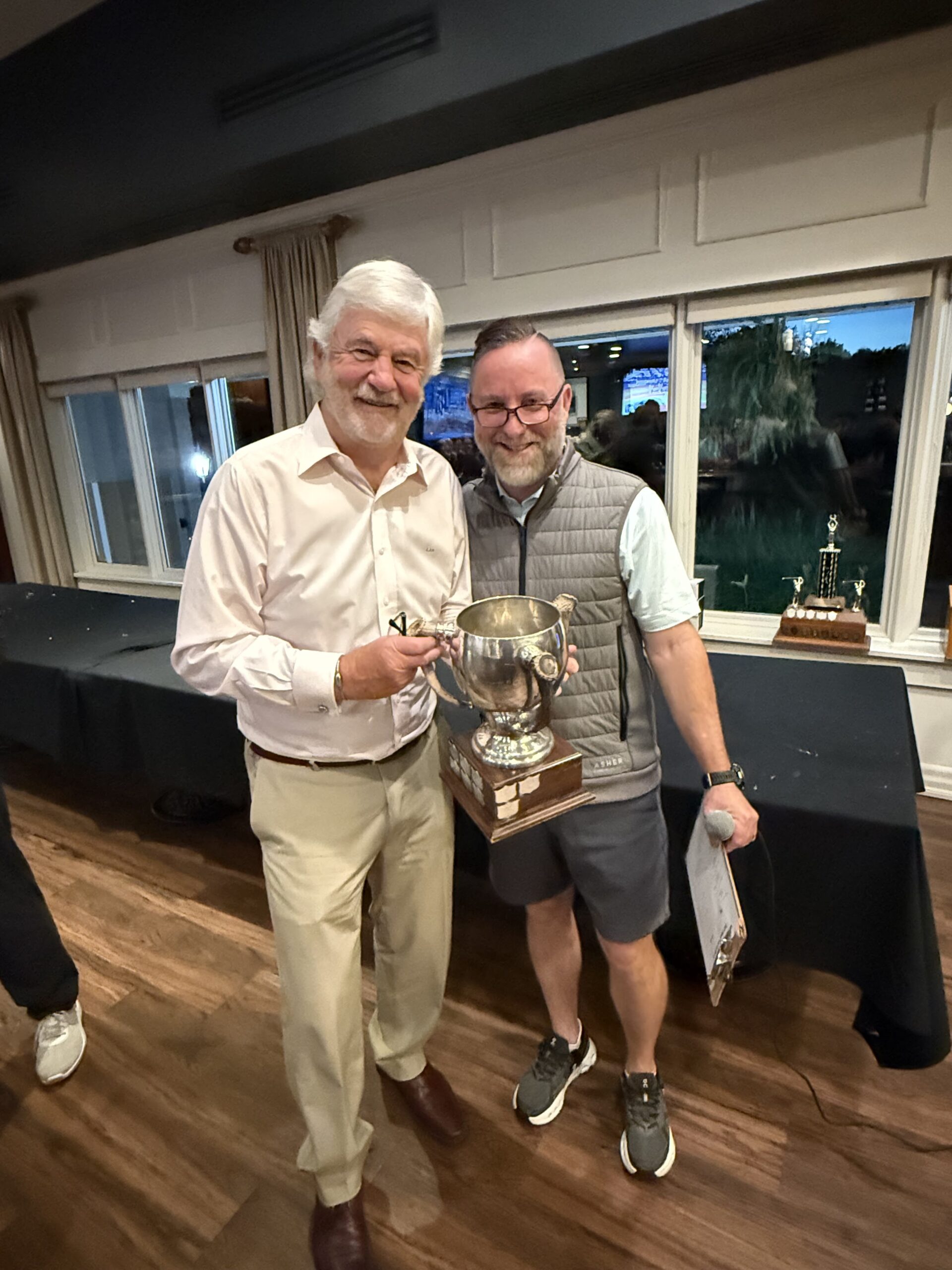 Stephen Warboys, the senior men's club champ, also won the Jim Brown Cup. He's shown with pro shop manager Darren Smith.