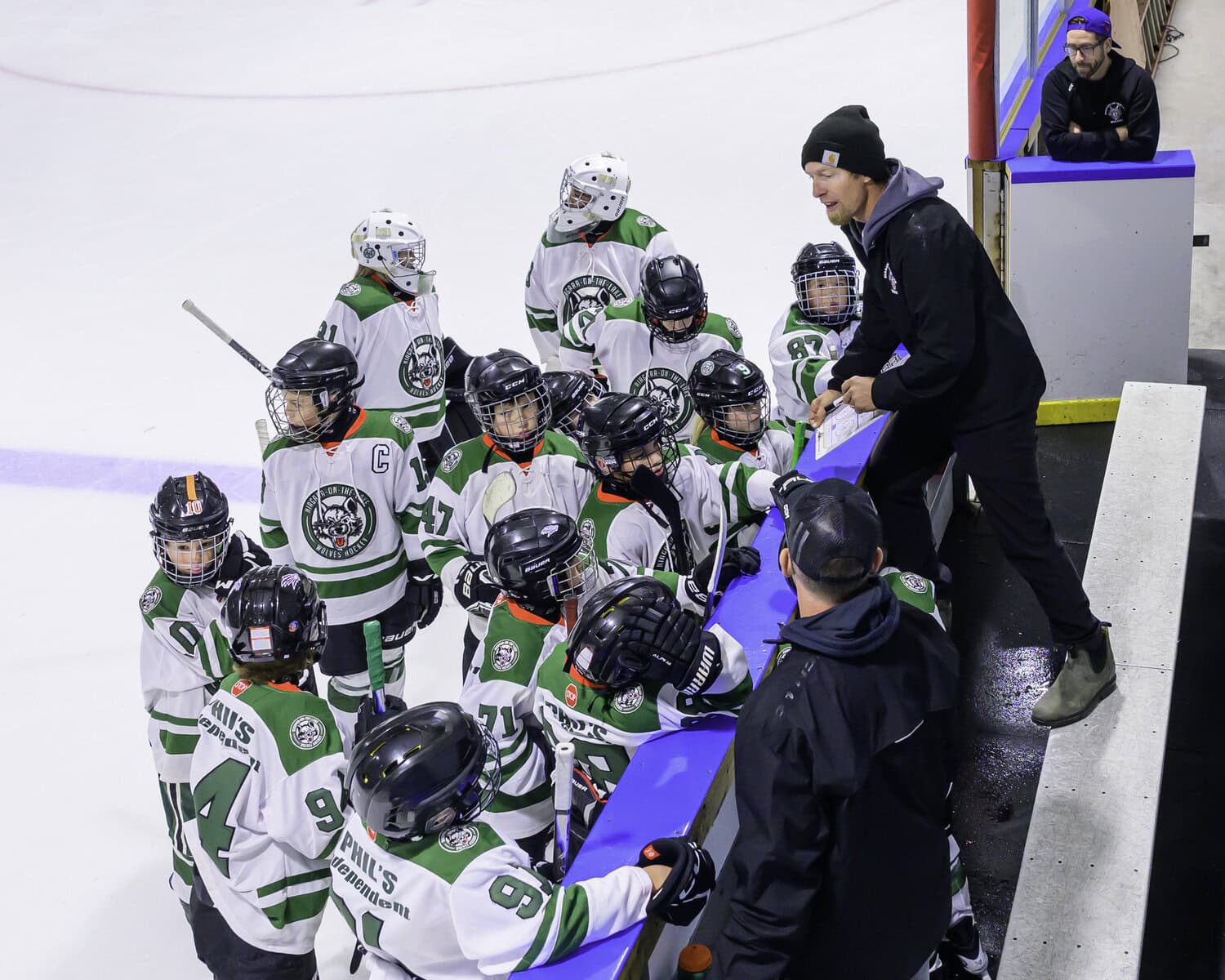 The U11 NOTL Wolves receive final instructions from their coach before heading into the third period against East Lambton. Despite a determined effort, the Wolves fell 8-3 in the matchup.