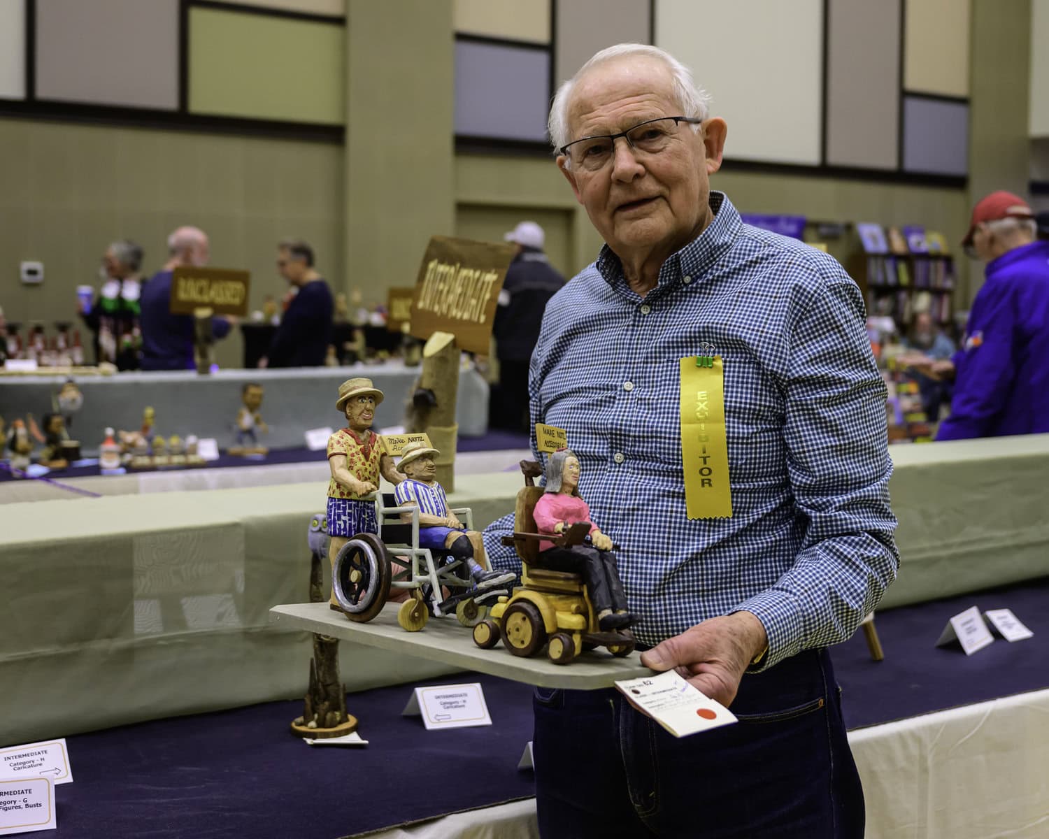 Bob Warkenton's carving comes with a message: its figurines, all using mobility devices, tout signs asking to make Niagara-on-the-Lake more accessible.