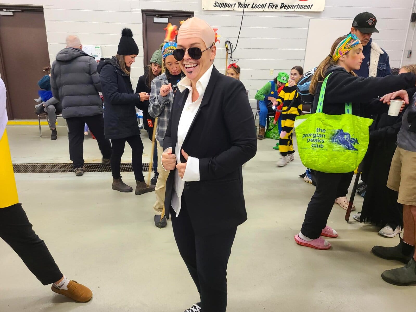 Jenna Booth dressed as “Mr. Worldwide” strikes a pose at the St. David’s Fire Hall. 