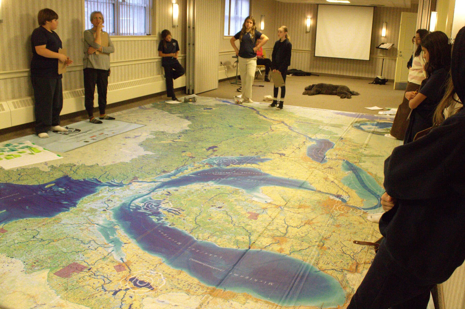 At the back wall, from left, Austin Puffer, teacher Melissa Smith, Charlie Marshall, Grayson Kerr and Amelia Walton. Most readily visible here on the map is Lake Michigan.