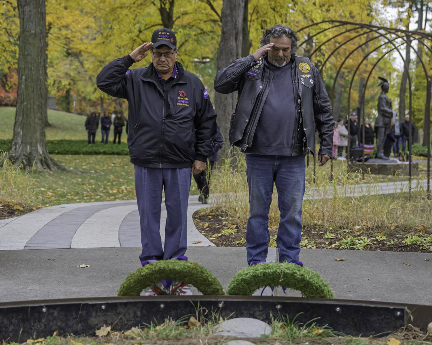 Rick Miller and David McIntyre were honoured for their military service during the Valour and Victory ceremony at Queenston Heights, and set a poppy wreath with a dream catcher at the site in honour of their fellow soldiers.