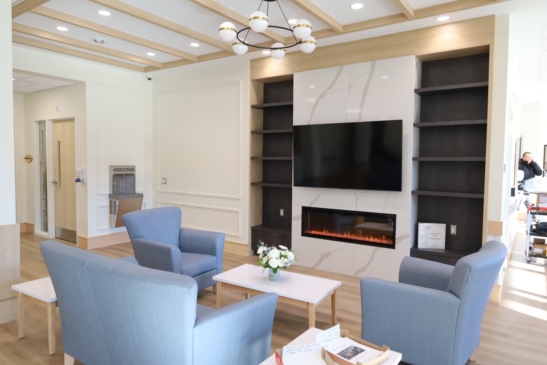 A seating area with a fireplace and television greets guests as they enter the new Pleasant Manor long-term care home. 