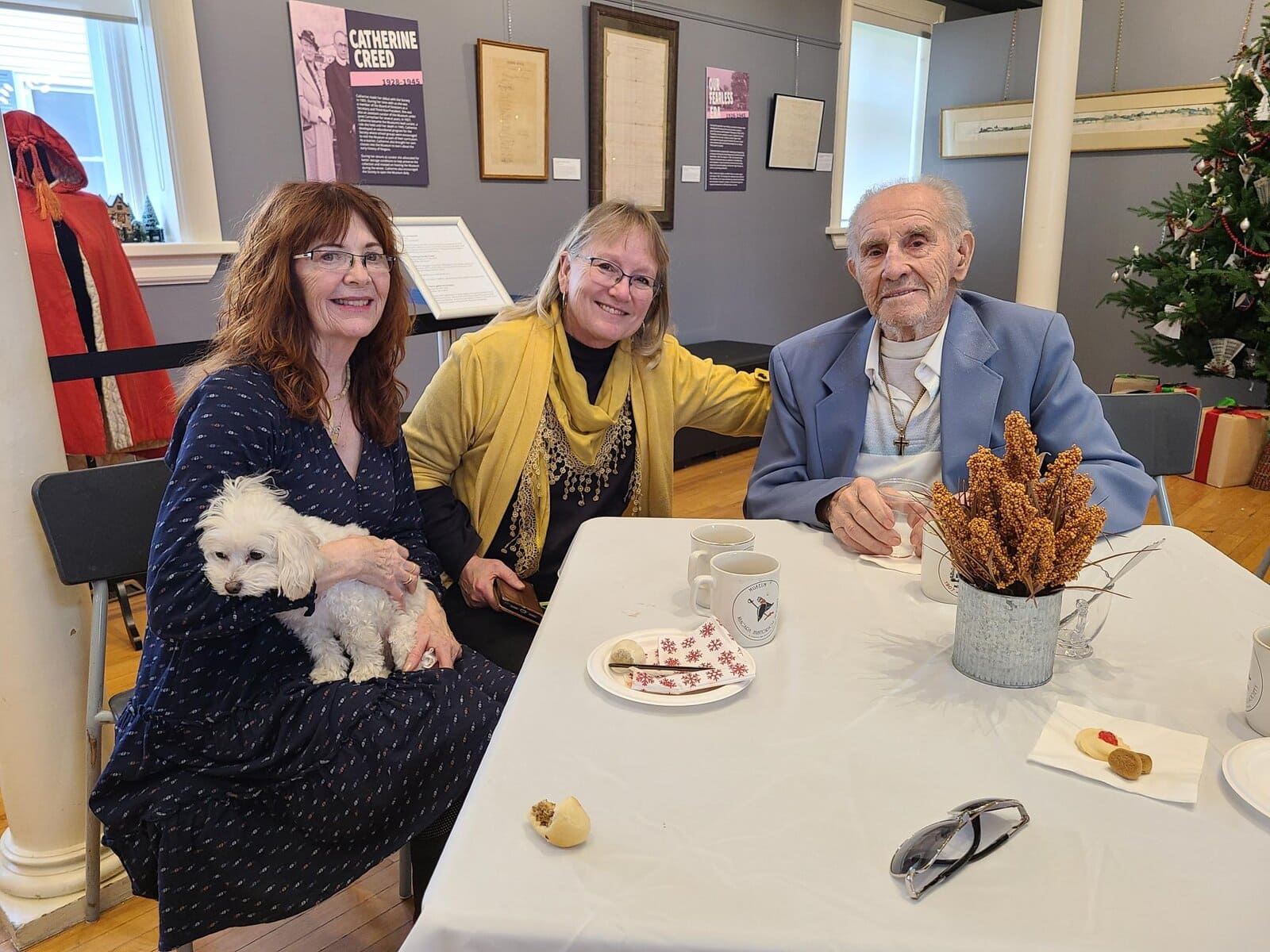 Barbara Worthy sits with Jane Epp and Abe Epp, who arrived in Niagara in 1934 at age five and later helped shape Virgil’s fruit farming community, featured in the museum’s oral history project. 