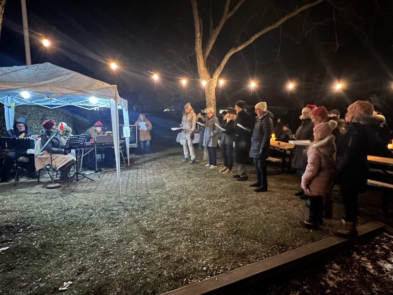 Carrollers from the neighbourhood enjoyed hot chocolate and treats — and had a live band on hand to accompany their festive tunes.
