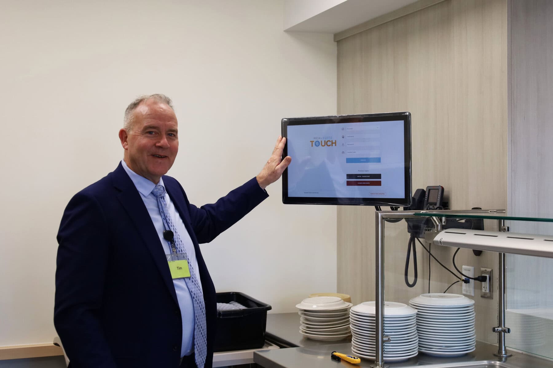 Radiant Care CEO Tim Siemens demonstrates the meal-planning system used by kitchen staff at Pleasant Manor’s new long-term care home.