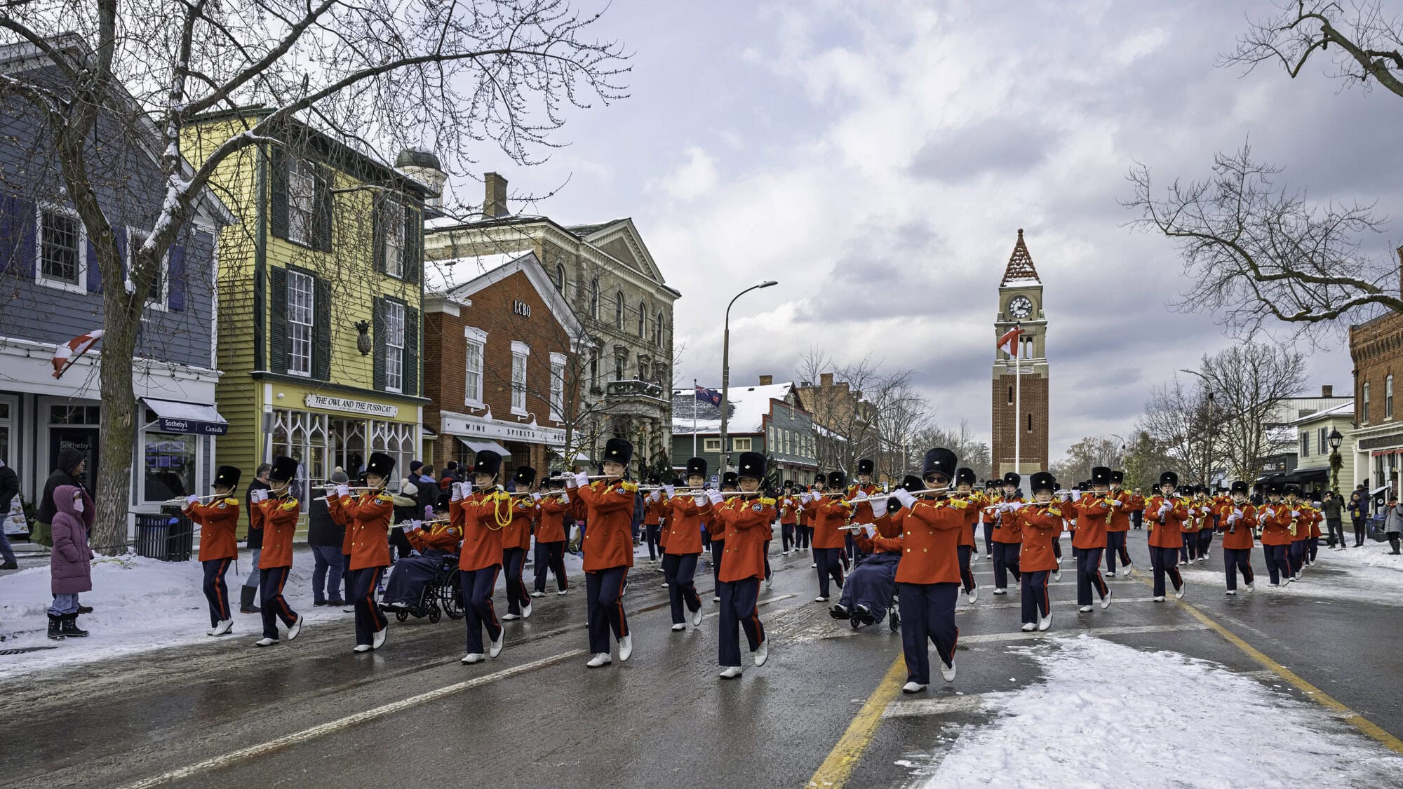 The Burlington Teen Tour Band provides a soundtrack for the Saturday afternoon parade, passing by the cenotaph clock tower.