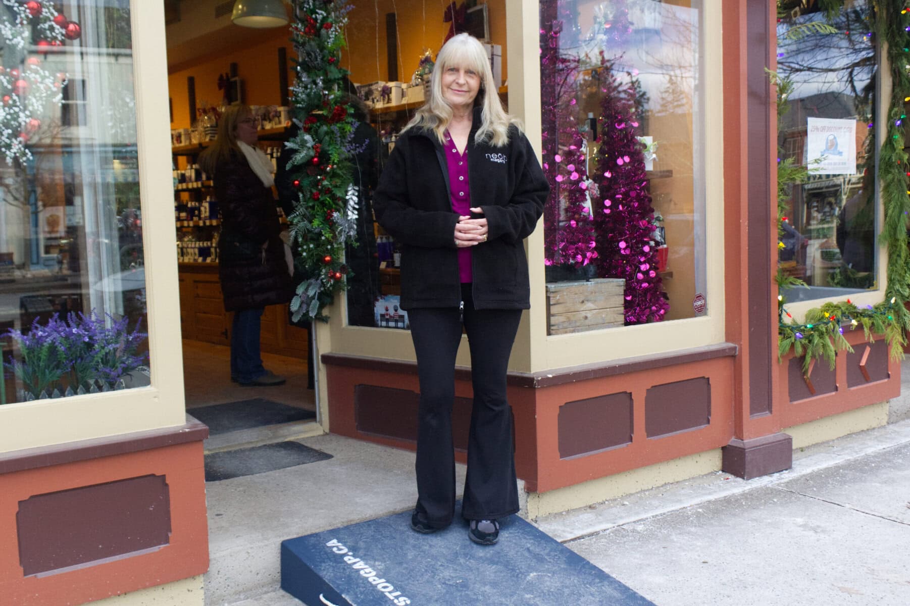 Sharon Chelmecki, team lead, at Neob Lavender on Queen St., shows off her StopGap ramp, which eight other businesses received on Friday. 